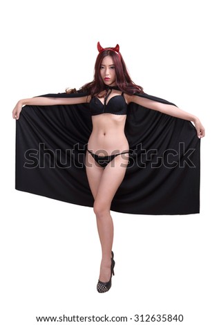portrait young woman witch in black bikini and devil horns on white background