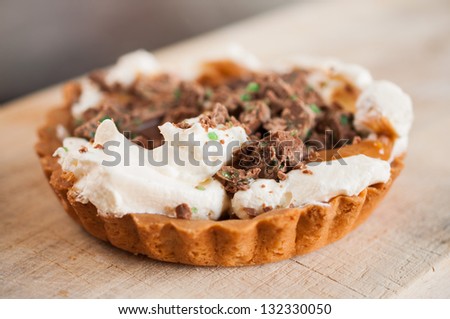 Peppermint Crisp Tart on a wooden pastry board