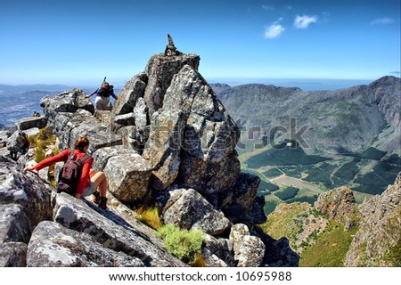 Hikers sliding downhill - and awesome mountain landscape as a background. Shot on Pieke, Jonkershoek Nature Reserve, near Stellenbosch, Western Cape, South Africa. Zdjęcia stock © 