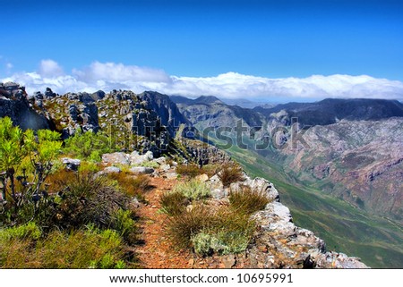 Track among rocks - and awesome mountain landscape as a background. Shot on Pieke, Jonkershoek Nature Reserve, near Stellenbosch, Western Cape, South Africa. Zdjęcia stock © 