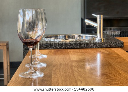 Row of glasses on wine-tasting table. Shot in Winelands near Stellenbosch, Western Cape, South Africa.