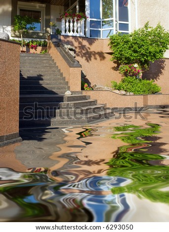 Marble stairs to beautiful swimming pool - in sunset light. Shot in Ukraine.