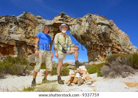 Young and old man in mountains. Shot in Wolfberg Mountains, Cederberg, Western Cape, South Africa.