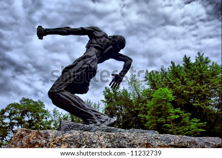 Falling man sculpture against sky. Shot in Kiev (Kyiv), Ukraine.