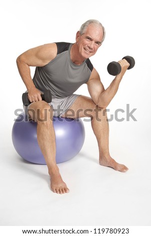 Elderly man works out with barbell weights
