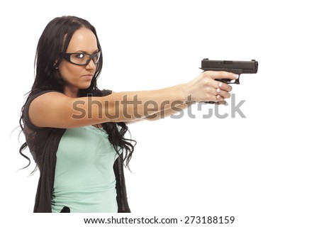 Female wearing eye protection aiming with pistol on white background.