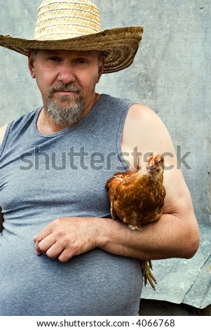 old farmer holding a chicken