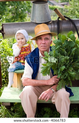 Grandfather with his little grand-daughter. Soft-focused. Focal point is on Grandfather