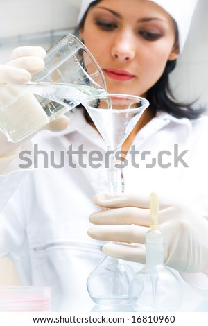 biological test of the water. Soft-focused, focal point is on the hands