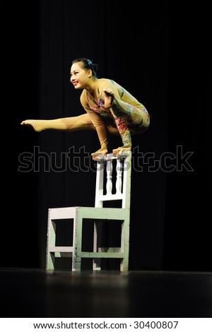 BELGRADE, SERBIA – MAY 16 : Chinese artist performs acrobatics at Great Chinese circus Confucius during their European Tour on May 16, 2009 in Belgrade.