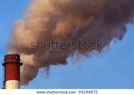 Close-up image of industrial chimney releasing toxic smog clouds to atmosphere