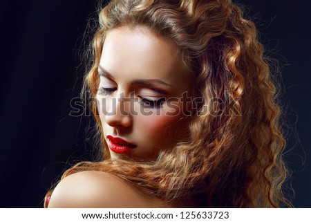 Portrait of a Beautiful Hot Girl With Long Curly Red Hair