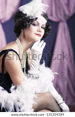 Beautiful young woman close up portrait in retro flapper style Vogue style vintage