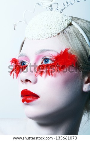 High fashion model close up Creative Makeup False red eyelashes Red lips