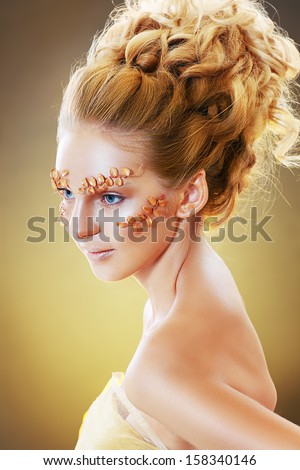 Beautiful Teen Model Fashion Glamour Makeup and Hairstyle. Glamor Golden Make-up.Holiday Gold Makeup