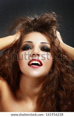 happy smiling playful woman touching her head and hair joyful satisfied