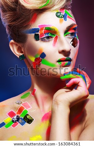 beauty woman with creative make up different colors and crystals