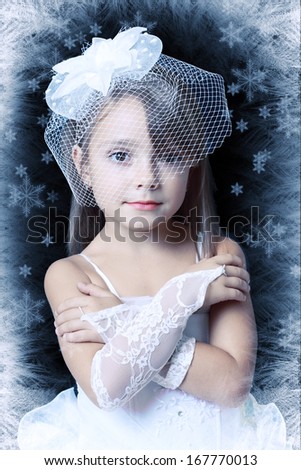 ice-queen. Little winter girl princess in creative image with silver blue artistic ice frame.