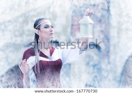 a fairy elf princess with snow ice on winter with lantern in her hand