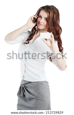 Beautiful brunette woman hold out blank card and speaking mobile phone isolated on white background