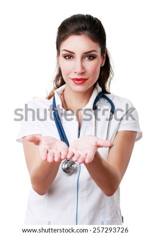 Beautiful successful female doctor holding something on her hands