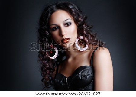 beautiful female high fashion model with flying curly hair