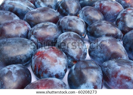 group of fresh purple plums close up