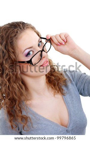 beautiful young woman face with perfect make up looking over glasses over white background