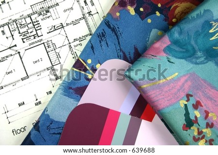 Interior design samples of paint and curtain fabrics with house plan blueprint in background