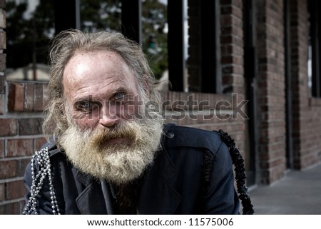 An old man with grey beard and blue eyes