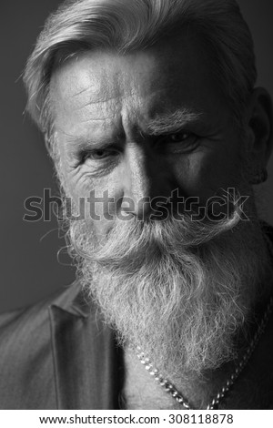 Black and White Portrait of a beard man with a long white beard.