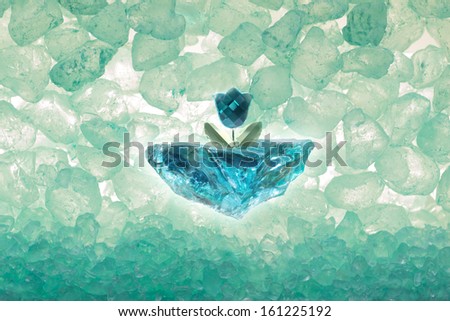 blue diamond cut tulip on a rough ice piece, with transparent stones through back light