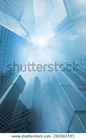 new york city skyscrapers with a sunbeam in the center of extreme perspective