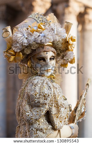 VENICE, ITALY - FEBRUARY 12: Unidentified persons in Venice mask at St. Mark\'s Square, Carnival of Venice on February 12, 2012. Annual carnival was held in 2012 from February 11 to February 21, 2012.
