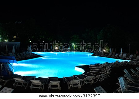 Night illumination in swimming pool in hotel