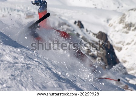 skier falling down the hill on the clouds of snow powder