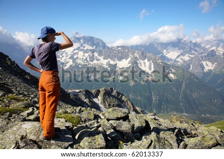 Traveler girl looking to far mountains