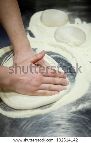 man hands knead dough