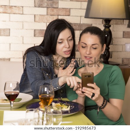 Two cute women having coffee break