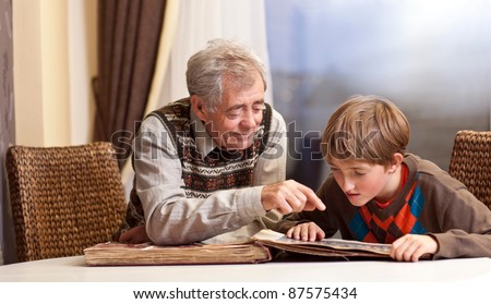 Grandfather and grandson watch  family album