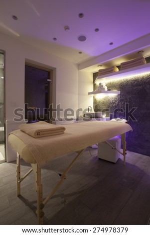 massage table in spa interior low ambient light