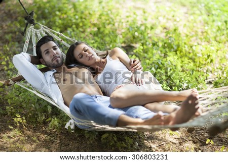 happy couple in love in a hammock,shallow depth of field