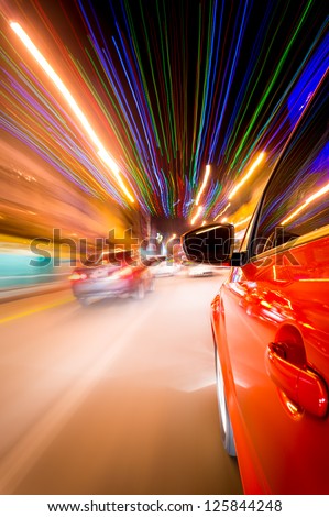 Night driving in city- abstract of motion blur and long exposure building light