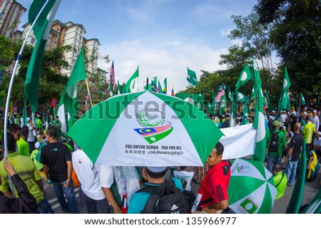 PUTRAJAYA,MALAYSIA-APRIL 20:People show big support to PAS political party candidate during nomination day on April 20,2013 in Putrajaya,Malaysia.The next Malaysian general election on 5 May 2013.