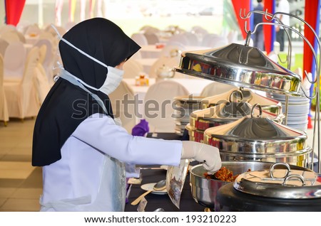 PUTRAJAYA, MALAYSIA - MAR 3:Environmental Health Office sampling food for law requirement on Mar 3, 2014 in Putrajaya. Sampling is necessary to ensure food is not contaminated with microbiology.