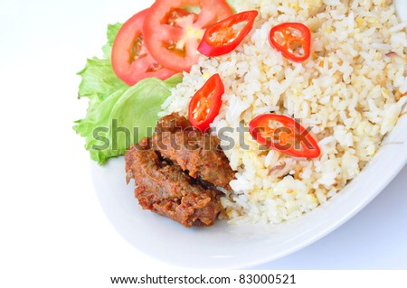 spicy fried rice with beef rendang close-up, malaysia style food