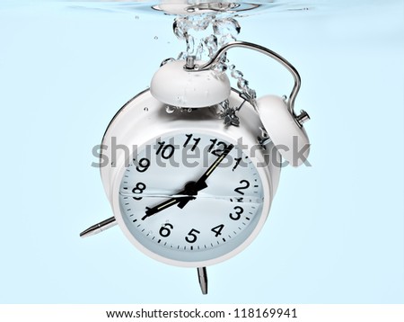 Alarm clock sinking under water