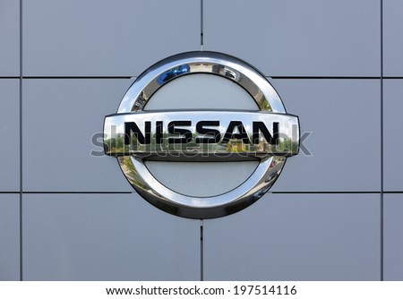 Dusseldorf, Germany - June 12, 2011: Nissan logo at the wall of car dealer\'s building. Nissan Motor Company Ltd is a multinational car manufacturer headquartered in Yokohama, Japan.