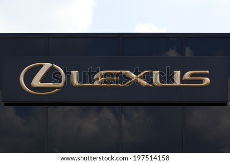 Dusseldorf, germany - June 12, 2011: Golden Lexus sign on car retailer\'s building. Lexus is the luxury vehicle division of Japanese car manufacturer Toyota Motor Corporation.
