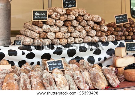 different kinds of french sausage, ham and Brebis cheese at market
